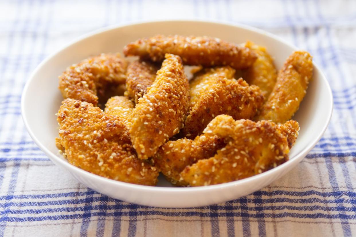 fried chicken strips served on white plate