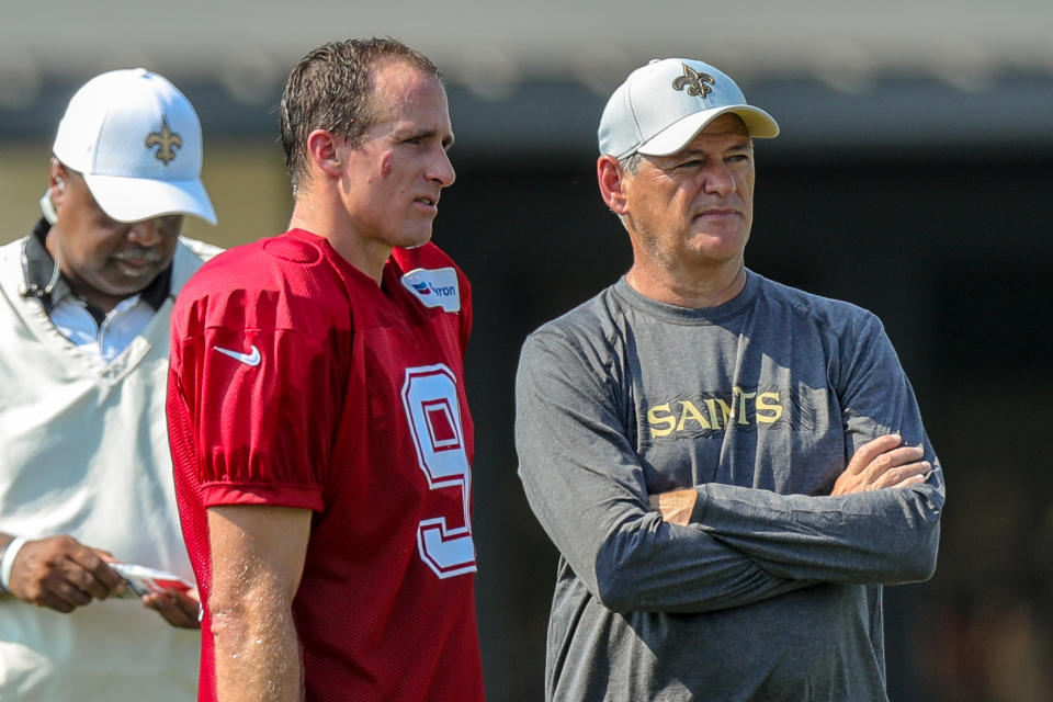 New Orleans Saints general manager Mickey Loomis, right, implied on Monday that quarterback Drew Brees can play for the team for as long as he'd like to keep playing. (Getty Images)