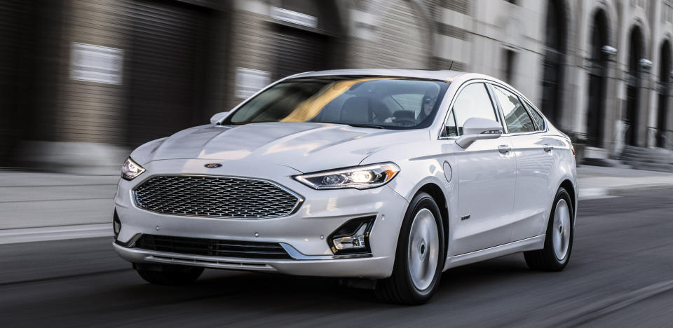 A white 2019 Ford Fusion, a midsize sedan.