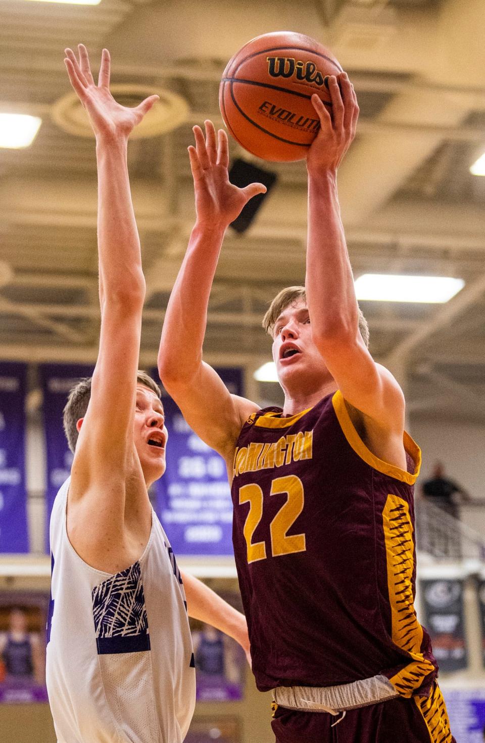 North's Luke Lindeman (22) shoots past South's Gavin Wisley (14) during the Bloomington North versus Bloomington South boys basketball game at Bloomington High School South on Friday, Jan. 6, 2023.