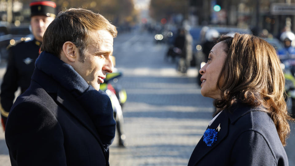 French President Emmanuel Macron speaks to Vice President Kamala Harris before ceremonies marking the 103rd anniversary of Armistice Day, Thursday, Nov. 11, 2021 in Paris. (Ludovic Marin, Pool via AP)