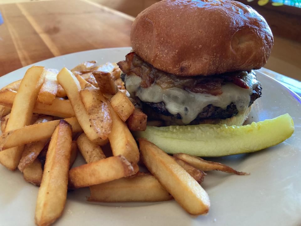 The Dumb Luck pub burger - a half-pound beef patty with cheddar cheese, applewood-smoked bacon and maple-bourbon caramelized onions - on April 10, 2023 at the Dumb Luck Pub & Grill in Hinesburg.