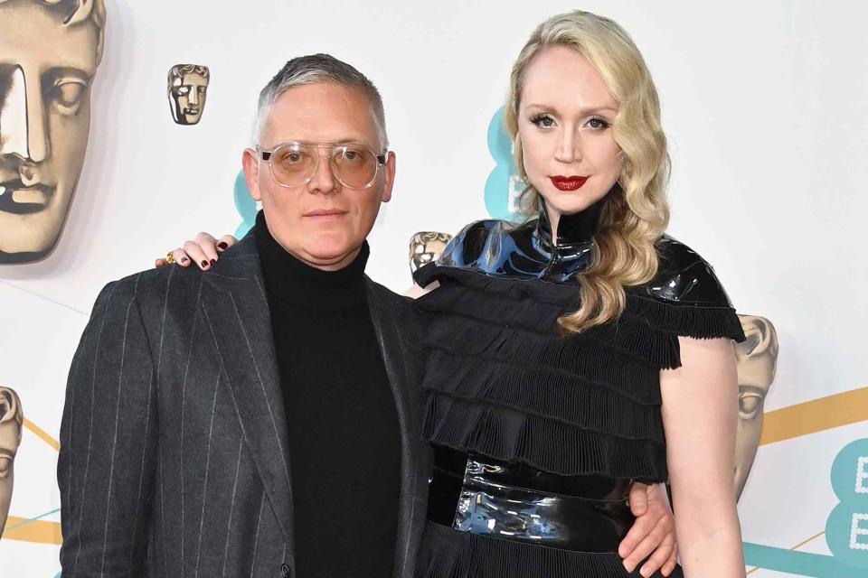 <p>Dave Benett/Getty </p> Giles Deacon and Gwendoline Christie arrive at the EE BAFTA Film Awards 2023 on February 19, 2023 in London, England.