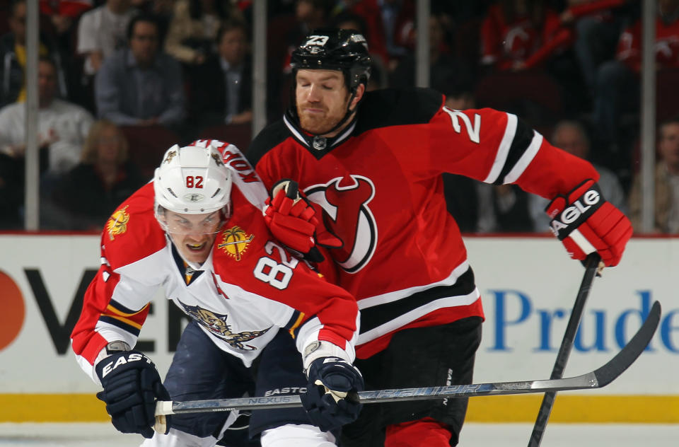 NEWARK, NJ - APRIL 19: David Clarkson #23 of the New Jersey Devils leans into Tomas Kopecky #82 of the Florida Panthers in Game Four of the Eastern Conference Quarterfinals during the 2012 NHL Stanley Cup Playoffs at Prudential Center on April 19, 2012 in Newark, New Jersey. (Photo by Bruce Bennett/Getty Images)