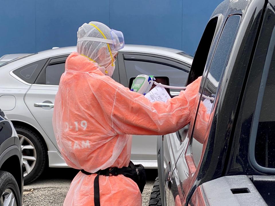 A health care worker at Innovative Express Care processes patients before administering antibody testing in Chicago, Ill., on April 24, 2020.