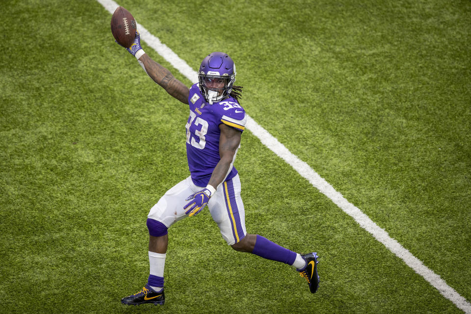 Minnesota Vikings running back Dalvin Cook holds the ball up as he runs into the end zone during the second half of an NFL football game against the Detroit Lions, Sunday, Nov. 8, 2020 in Minneapolis. (Elizabeth Flores/Star Tribune via AP)