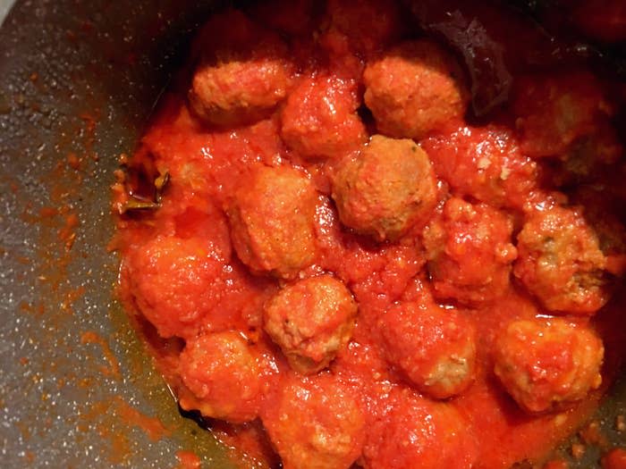 A pot of meatballs in tomato sauce