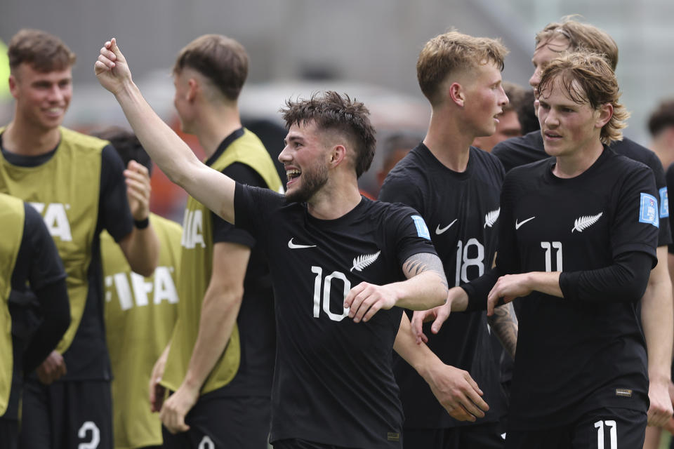 New Zealand's Jay Herdman celebrates with teammates after scoring his team's second goal against Uzbekistan during a FIFA U-20 World Cup group A soccer match at Madre de Ciudades stadium in Santiago del Estero, Argentina, Tuesday, May 23, 2023. (AP Photo/Nicolas Aguilera)