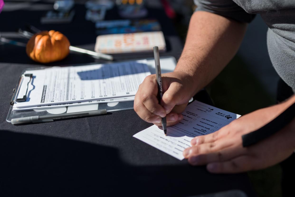 Students register to vote and sign pledges at Leech Grove on the UTEP campus at a registration drive held by EPPC and the UTEP chapter of Texas Rising on the last day to register to vote on Tuesday, Oct. 11, 2022.