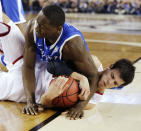 Kentucky forward Julius Randle (30) and,Wisconsin forward Duje Dukan go after a loose ball during the second half of the NCAA Final Four tournament college basketball semifinal game Saturday, April 5, 2014, in Arlington, Texas. (AP Photo/David J. Phillip)