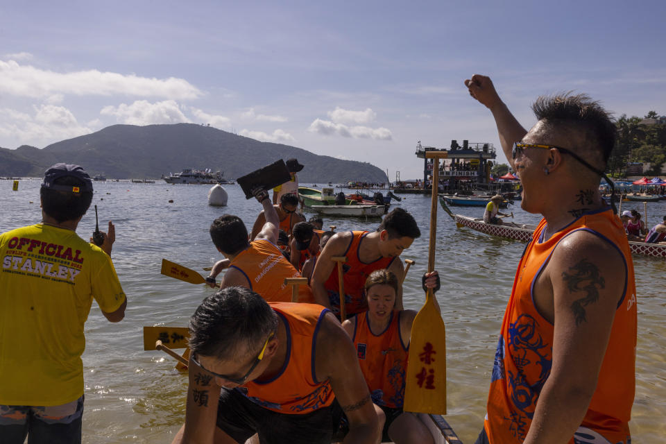 Competitors take part in the annual dragon boat race to celebrate the Tuen Ng festival in Hong Kong, Thursday, June 22, 2023. (AP Photo/Louise Delmotte)