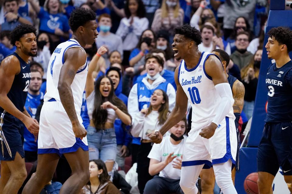 Seton Hall's Alexis Yetna (10) and forward Tyrese Samuel (4) celebrate after Yetna scored and drew a foul during the first half of the team's NCAA college basketball game against Xavier, Wednesday, Feb. 9, 2022