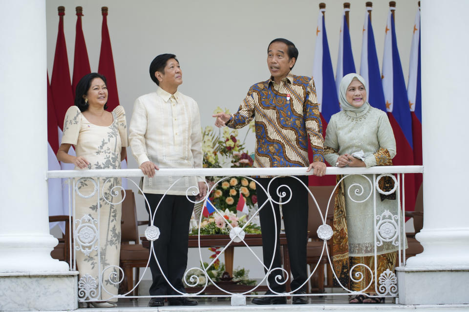 Philippine President Ferdinand Marcos Jr. second left, and his wife Madame Louise Araneta Marcos, left, share a light moment Indonesian President Joko Widodo and his wife Iriana during their meeting at the Presidential Palace in Bogor, Indonesia, Monday, Sept, 5, 2022.(AP Photo/Achmad Ibrahim, Pool)