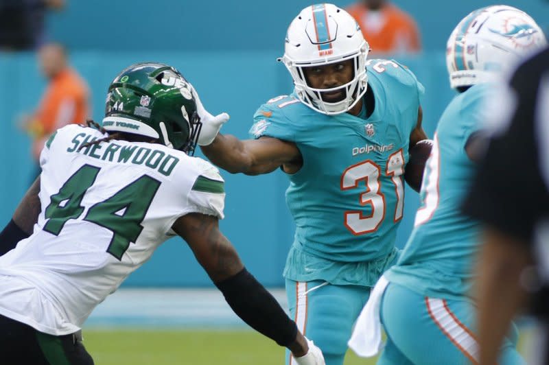 Coaches consider Raheem Mostert (R) a "leader" in the Miami Dolphins running backs room. File Photo by Thom Baur/UPI