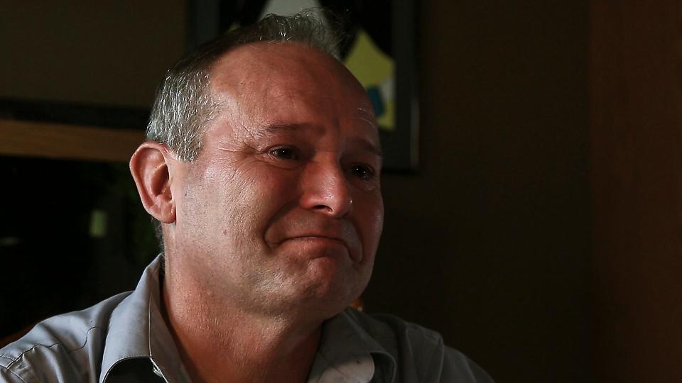 Jeff Dettbarn tries to hold back tears during an interview on Thursday afternoon, Aug. 30, 2018, at his home in eastern Iowa. Dettbarn is a CT technologist at the Iowa City Veterans Affairs Medical Center.