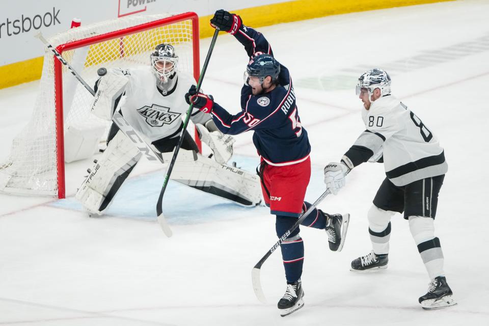 Dec 5, 2023; Columbus, Ohio, USA; Columbus Blue Jackets left wing Eric Robinson (50) tries to redirect a puck between Los Angeles Kings goaltender Pheonix Copley (29) and left wing Pierre-Luc Dubois (80) during the second period of the NHL game at Nationwide Arena.
