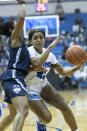 Memphis guard Jamirah Shutes, right, drives defended by Connecticut guard Christyn Williams, left, in the first half of an NCAA college basketball game Tuesday, Jan. 14, 2020, in Memphis, Tenn. (AP Photo/Nikki Boertman)