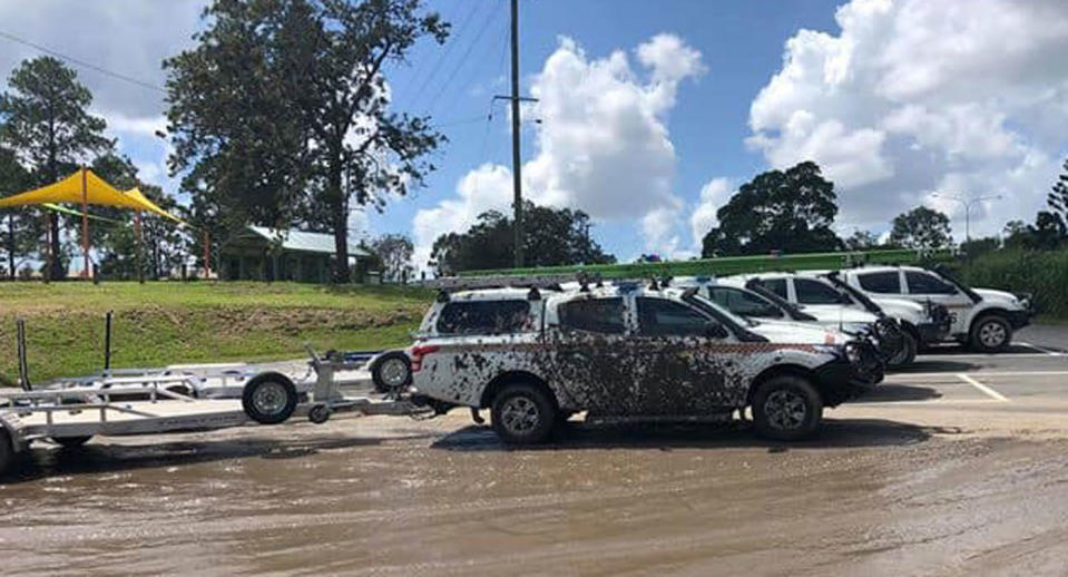 A Logan City SES vehicle parked at Loganlea Boat Ramp covered in mud.