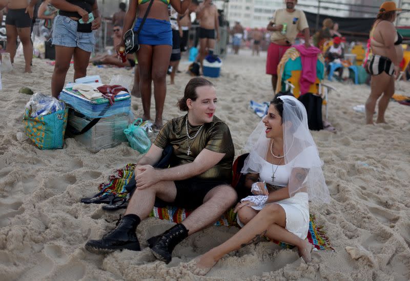 People gather for Madonna's concert at Copacabana beach, in Rio de Janeiro
