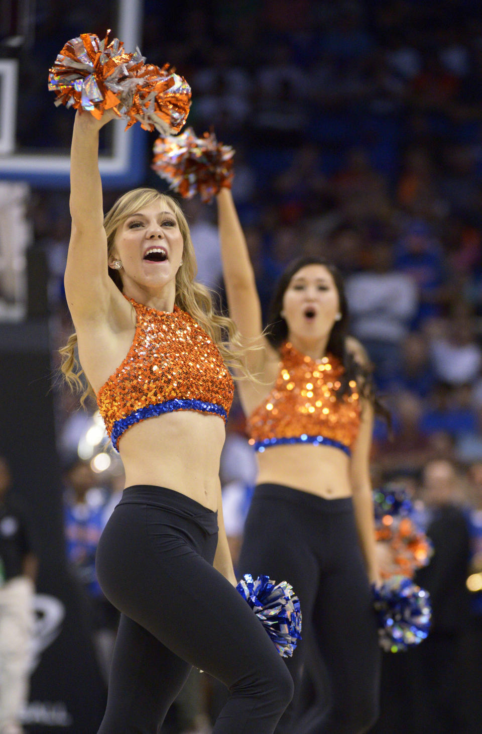 Florida cheerleaders perform during the first half in a third-round game at the NCAA college basketball tournament against Pittsburgh, Saturday, March 22, 2014, in Orlando, Fla. (AP Photo/Phelan M. Ebenhack)