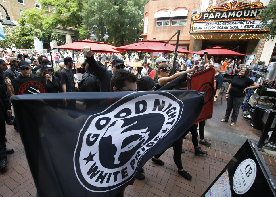 A group Anti-fascism demonstrators, march in the downtown area in anticipation of the anniversary of last year's Unite the Right rally in Charlottesville, Va., Saturday, Aug. 11, 2018. (AP Photo/Steve Helber)