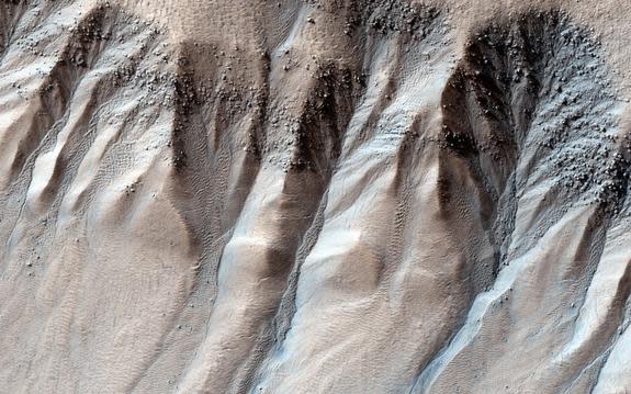 A spectacular example of gullies on Mars, at roughly 71 degrees latitude in the southern hemisphere.