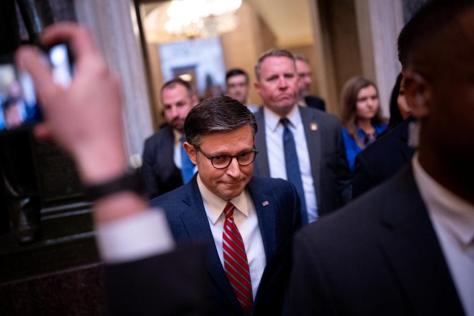 House Speaker Mike Johnson walks towards the House Chamber on Capitol Hill on Friday (Getty Images)