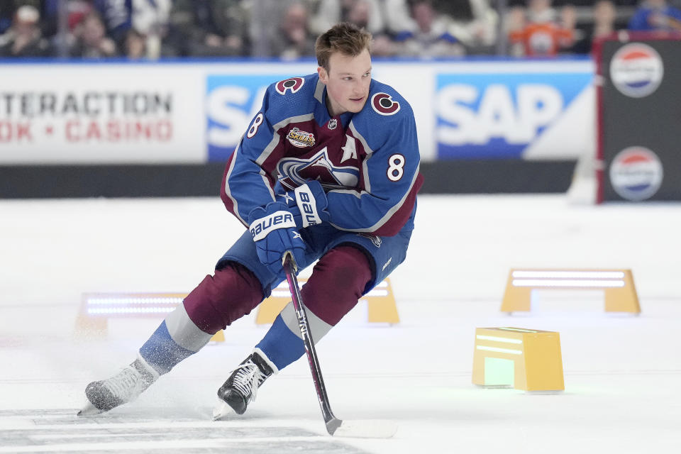 Colorado Avalanche's Cale Makar takes part in the NHL All-Star skills competition's hockey obstacle course section in Toronto, Friday, Feb. 2, 2024. (Nathan Denette/The Canadian Press via AP)