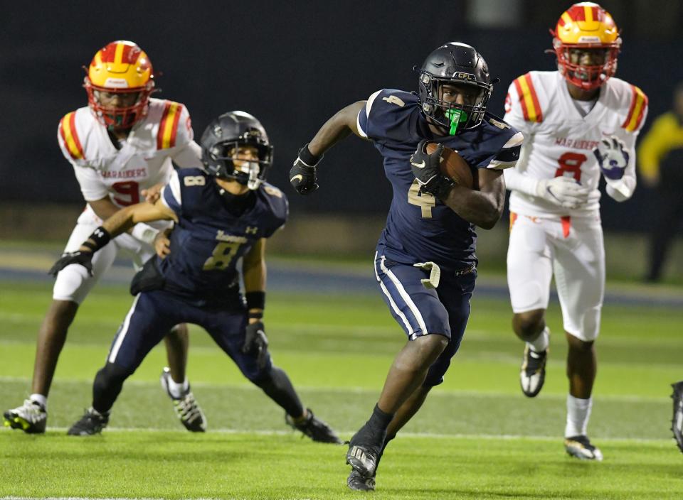 University Christian's Orel Gray (4) sprints to the end zone for a fourth quarter touchdown. The Clearwater Central Catholic Marauders traveled to Jacksonville, FL to take on the University Christian Christians in the Florida High School Athletic Association Class 1M starts football semifinal match Friday, December 2, 2022. The Marauders came away with a 29 to 34 win over the Christians.