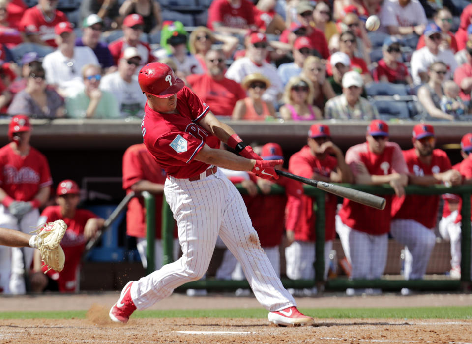 Philadelphia Phillies' J.T. Realmuto flies out in the fourth inning during a spring training baseball game against the Pittsburgh Pirates, Saturday, Feb. 23, 2019, in Clearwater, Fla. (AP Photo/Lynne Sladky)