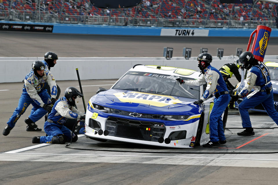 Chase Elliott (9) makes a pit stop for tires and fuel during the NASCAR Cup Series auto race at Phoenix Raceway, Sunday, Nov. 8, 2020, in Avondale, Ariz. (AP Photo/Ralph Freso)