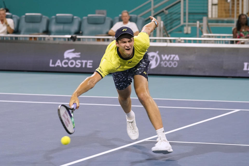 Hubert Hurkacz, of Poland, can't get to a shot from Carlos Alcaraz, of Spain, during the Miami Open tennis tournament semifinals Friday, April 1, 2022, in Miami Gardens, Fla. (AP Photo/Marta Lavandier)