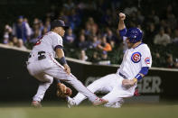 Chicago Cubs' Patrick Wisdom, right, steals second as Minnesota Twins' Luis Arraez waits for the throw from catcher Mitch Garver during the third inning of a baseball game Tuesday, Sept. 21, 2021, in Chicago. (AP Photo/Charles Rex Arbogast)