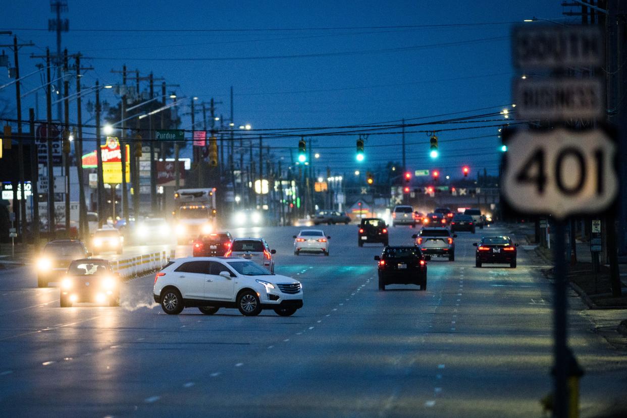 Traffic moves along Raeford Road in Fayetteville as a light freezing rain comes down on Friday, Jan. 21, 2022.