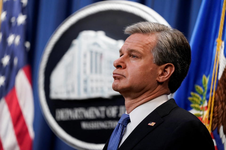 FBI Director Christopher Wray attends a news conference as U.S. Attorney General Merrick Garland announces enforcement actions against Russia, at the Justice Department in Washington, U.S., April 6, 2022. REUTERS/Elizabeth Frantz