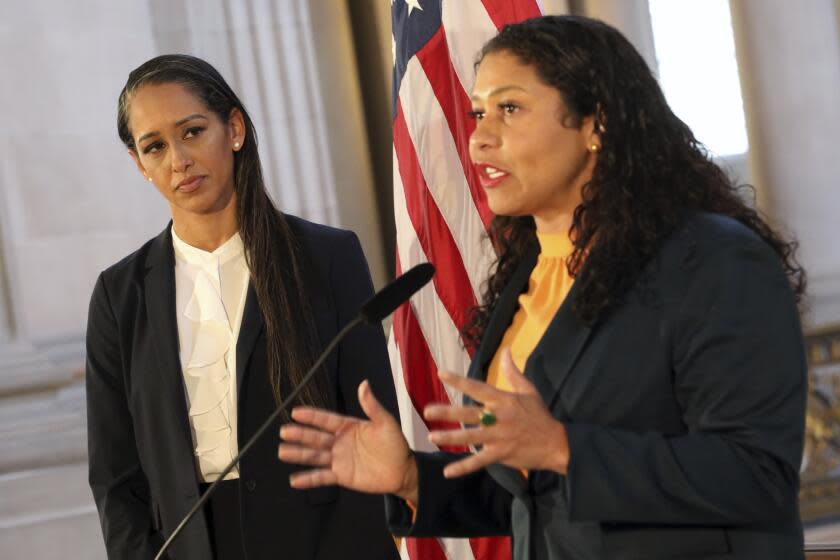 Mayor London Breed addresses a news conference as Brooke Jenkins looks on at City Hall, Thursday, July 7, 2022, in San Francisco. (Santiago Mejia/San Francisco Chronicle via AP)