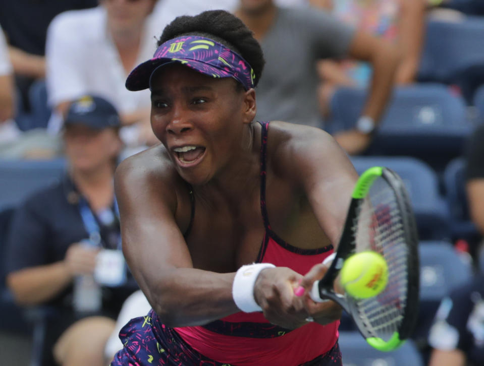 Venus Williams returns the ball to Camila Giorgi, of Italy, during the second round of the U.S. Open tennis tournament, Wednesday, Aug. 29, 2018, in New York. (AP Photo/Frank Franklin II)