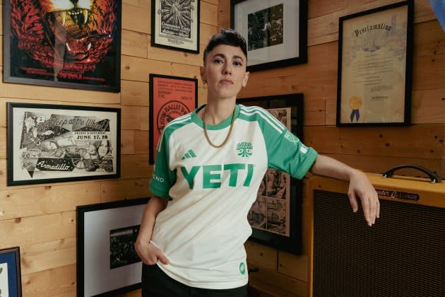 Gina Chavez poses in the 2024 Secondary Kit for Austin FC, a jersey inspired by the Armadillo World Headquarters. - Credit: Jacob Gonzalez/Austin FC*