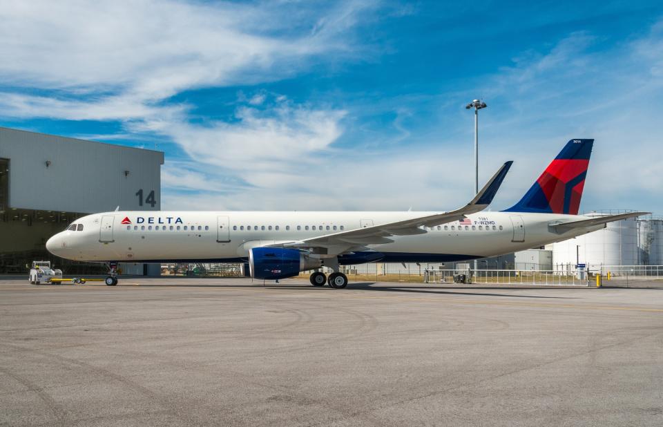 A Delta Air Lines plane parked on a tarmac.