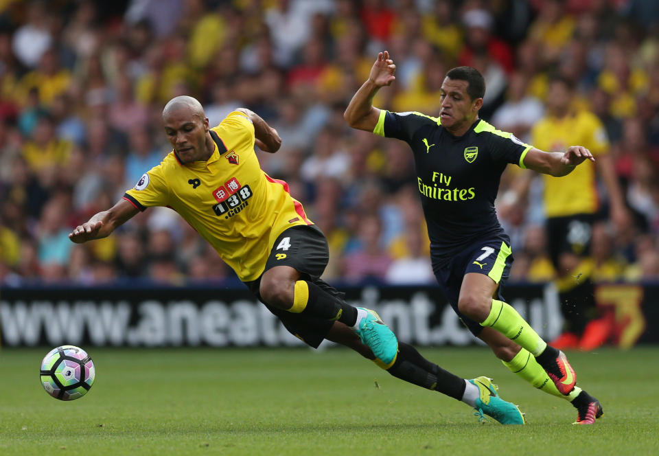 Football Soccer Britain - Watford v Arsenal - Premier League - Vicarage Road - 27/8/16 Watford's Younes Kaboul in action with Arsenal's Alexis Sanchez Action Images via Reuters / Andrew Boyers Livepic EDITORIAL USE ONLY. No use with unauthorized audio, video, data, fixture lists, club/league logos or "live" services. Online in-match use limited to 45 images, no video emulation. No use in betting, games or single club/league/player publications. Please contact your account representative for further details.