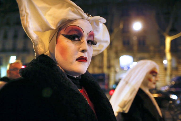 Members of "Les Soeurs de la Perpetuelle Indulgence" (Sisters of Perpetual Indulgence) walk in the streets near the French National Assembly in Paris on January 29, 2013. France's prime minister on Tuesday predicted that gay marriage will quickly be accepted by a country that has spent months embroiled in rancorous debate