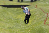 Rory Sabbatini hits from a hazard on the 18th hole during the first round of the Rocket Mortgage Classic golf tournament, Thursday, July 2, 2020, at the Detroit Golf Club in Detroit. (AP Photo/Carlos Osorio)