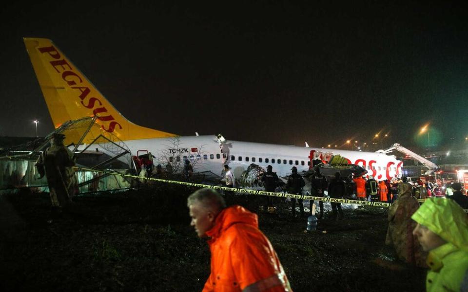 A view of the site as firefighters, paramedics conducting operations and injured passengers are being dispatching to hospitals after a passenger plane skidded off the runway in Istanbul Sabiha Gokcen International Airport, breaking into two, on February 05, 2020 in Istanbul, Turkey. ( | Anadolu Agency/Getty Images