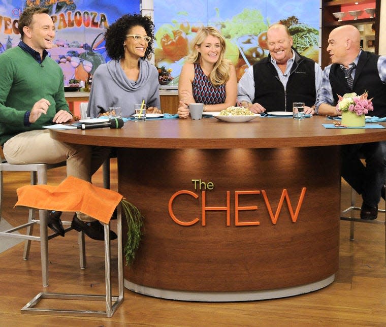 This Sept. 17, 2013 photo shows the hosts of "The Chew," from left, Clinton Kelly, Carla Hall, Daphne Oz, Mario Batali and Michael Symon in the studio in New York. "The Chew" marks its 500th edition Tuesday. (AP Photo/ABC, Jeff Neira)