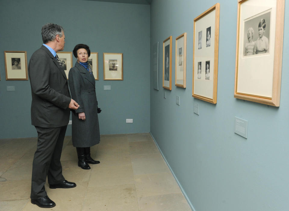 The Princess Royal speaks with David Lascelles, Earl of Harewood, as they view an exhibition of royal photographs taken by royal photographer Marcus Adams on display at Harewood House, Leeds.   (Photo by Anna Gowthorpe/PA Images via Getty Images)