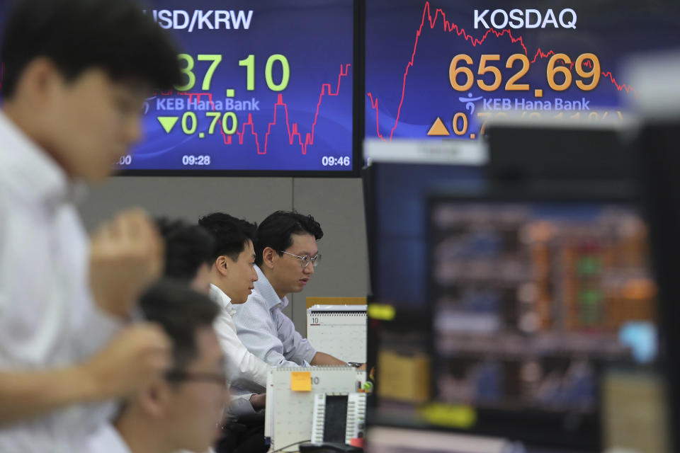 Currency traders watch monitors at the foreign exchange dealing room of the KEB Hana Bank headquarters in Seoul, South Korea, Thursday, Oct. 17, 2019. Asian shares were mixed Thursday after officials signaled work remains to be done on an agreement for a truce in the tariff war between the U.S. and China. (AP Photo/Ahn Young-joon)