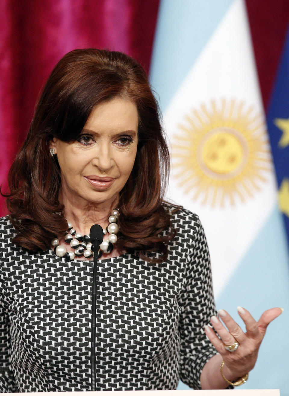 Argentine President Cristina Fernandez speaks during a press conference with French President Francois Hollande at the Elysee Palace in Paris, Wednesday, March 19, 2014. Fernandez met French counterpart and discussed ways to tackle her country's growing international debt. (AP Photo/Christophe Ena)