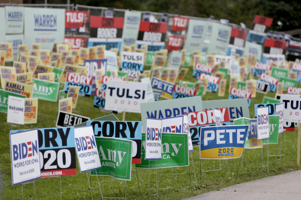 Election signs of the various democratic candidates are planted at the Polk County Democrats Steak Fry, in Des Moines, Iowa, Saturday, Sept. 21, 2019. (AP Photo/Nati Harnik)