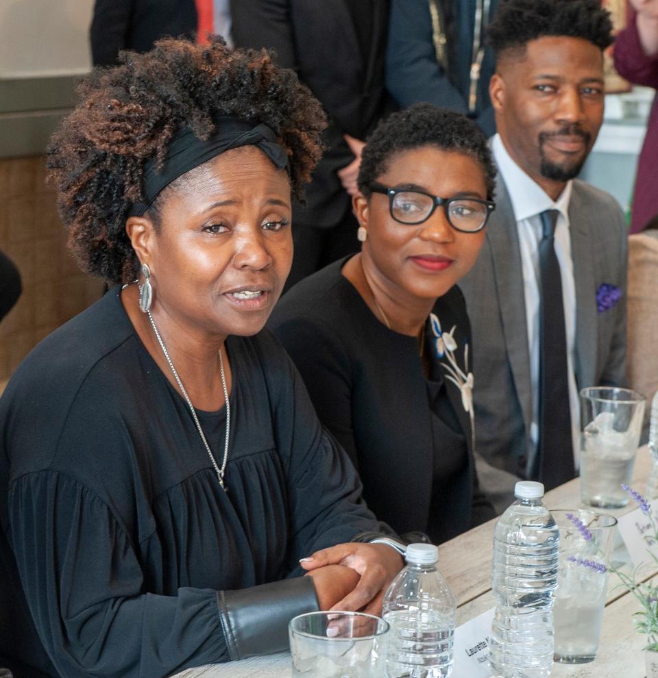 Laurette Ndukwe, owner of Nzuko Restaurant in Framingham, speaks during a meeting at her restaurant involving Black business owners and local, state and federal officials, April 24, 2023.