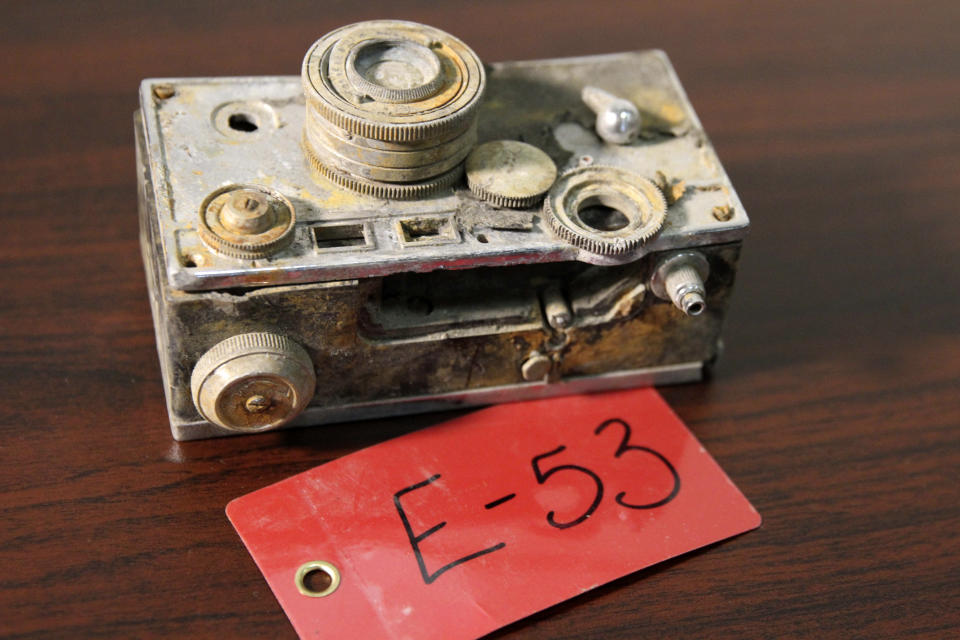 A camera recovered from the 1952 crash of a C-124 Globemaster was found this month on Colony Glacier and displayed at Joint Base Elmendorf-Richardson, Alaska, Tuesday, Sept. 29, 2021. The plane slammed into a mountain, killing 52 on board, and the plane and its crew have since become part of the glacier. The military has conducted annual summer recovery efforts, finding human remains and personal items on the glacier. (AP Photo/Mark Thiessen)